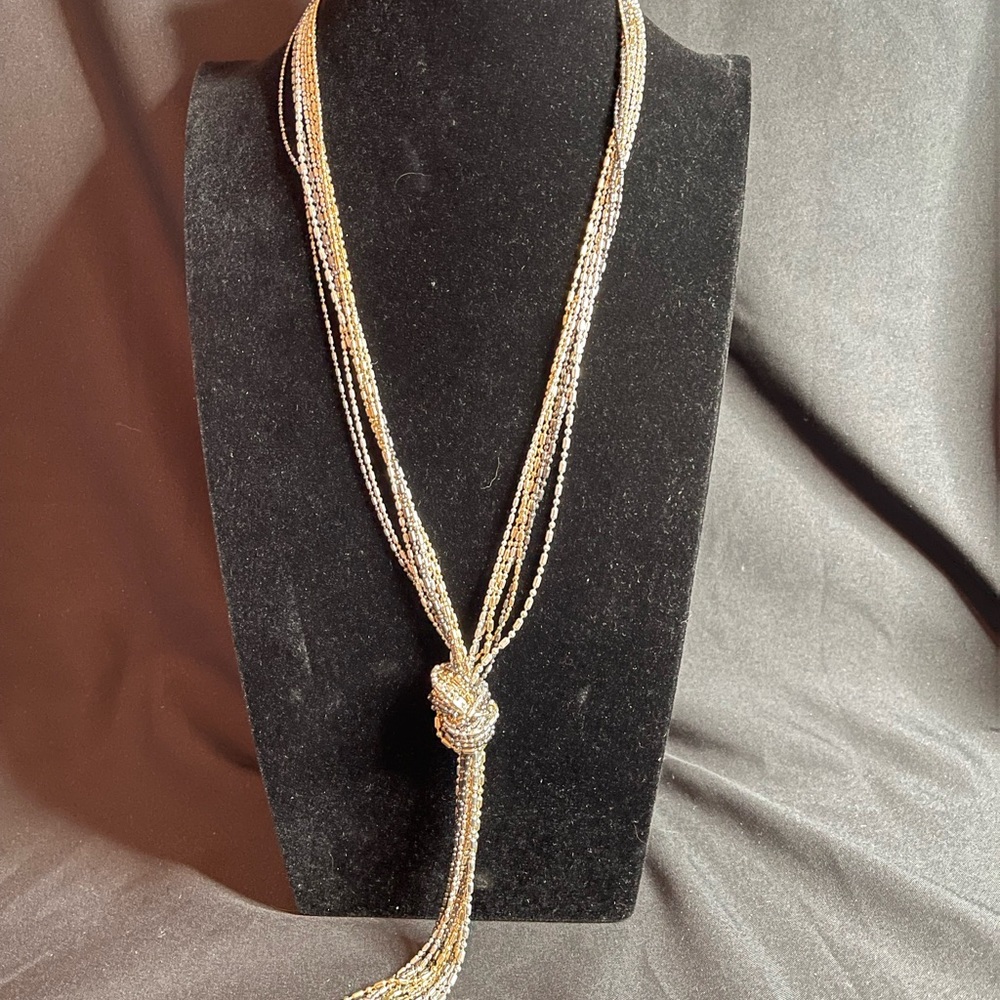 Gold Black and Silver Tone Seven Strand Twisted Necklace with Knotted Tassel